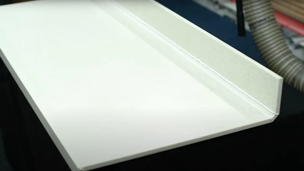 Solid surface with v-groove